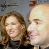 Retired tennis players and husband-and-wife Andre Agassi and Steffi Graf attend a quarterfinals match between Mikhail Youzhny of Russia and Roger Federer of Switzerland at the All England Lawn Tennis Championships at Wimbledon, England, on July 4, 2012.