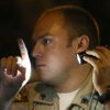 A man suspected of driving while impaired attempts to perform the walk-and-turn field sobriety test for Metro Police Officer Jeffery Bengel and interpreter Lavern Romero, left, at a July 2010 night checkpoint.
