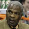 In this Jan. 20, 2011 photo, Charlotte Bobcats assistant coach Charles Oakley, right, talks with Eduardo Najera, left, in the first half of an NBA basketball game against the Philadelphia 76ers in Charlotte, N.C.  