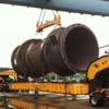 A giant anode is put onto a custom trailer near Salt Lake City for its trip south to Arizona. The oversize load will be passing through Las Vegas Monday.