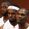 In this Dec. 12, 2011, photo, Miami Heat players Dwyane Wade, back, LeBron James and Chris Bosh pose for photos during the NBA basketball team's media day in Miami. It's Act Two for the Big Three, and the Heat are bringing back almost the exact same cast for what they hope is another title shot. 
