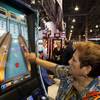 Beverage server Christa Evanko delivers drinks at the Mohegan Sun at Pocono Downs casino in Wilkes-Barre, Pa.