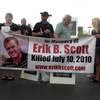 Friends and supporters mark the one-year anniversary of Erik Scott's death outside the Summerlin Costco, where he was fatally shot by Metro Police officers. 