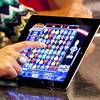 A video slot machine game is displayed on an Apple iPad in the Casinfo booth during the first day of the Global Gaming Expo (G2E) convention at the Sands Expo Center Tuesday, Oct. 4, 2011.