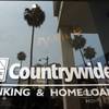 In this June 25, 2008, file photo, buildings and palm trees are reflected on the entrance of the Countrywide Financial Corp. office in Beverly Hills, Calif.  The top federal prosecutor in Manhattan sued Bank of America for more than $1 billion on Wednesday, Oct. 24, 2012, for mortgage fraud against Fannie Mae and Freddie Mac during the years around the financial crisis.
