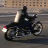 Motorcyclists drive past Harrah's casino in Laughlin on the final day of the River Run motorcycle gathering April 28, 2002.