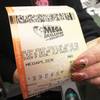 A Mega Millions play-slip for those players preferring to choose the numbers they want to play is among the stacks of other lottery game play-slips displayed in Cranberry Township, Pa., Friday, Jan. 22, 2021.