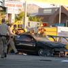 Metro Police investigate after a car crashed into a bus stop on Spring Mountain Road east of Decatur Boulevard, killing four people, on Thursday, Sept. 13, 2012.