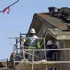Today, 48,500 people work in construction locally, up 39 percent from the depths of the Great Recession. In this photo, carpenters work on an apartment complex under construction Tuesday, April 7, 2015, at Hualapai and Peace Ways.