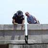 Nevada Highway Patrol troopers and Nevada Department of Transportation workers inspect an expansion joint on the 95 south to I-15 south ramp after an earthquake Friday, May 22, 2015.