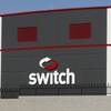 In this Wednesday, Sept. 9, 2015, photo, a car drives by a Switch data center in Las Vegas.