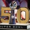 The Vince Lombardi Trophy in front of the No. 50, the number of the Super Bowl in February, at NFL Network studios Wednesday, Sept. 9, 2015, in Culver City, Calif. Cox Communications subscribers in Las Vegas won't be able to watch the game on TV if the cable provider and KLAS don't reach an agreement on their contract, which expires Jan. 29.