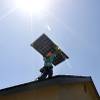 Solar supporters rally in front of the Public Utilities Commission offices Wednesday, Jan 13, 2016.