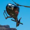 Owners Greg and Brenda Rochna are having their Maverick Helicopters 20th anniversary, standing with one of their aircraft at the Henderson Executive Airport.