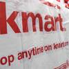 In ths Nov. 19, 2009, file photo, shoppers wait in the checkout line at a Kmart store in Somerville, Mass.