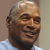 Former football legend O.J. Simpson signs documents at the Lovelock Correctional Center, Saturday, Sept. 30, 2017, in Lovelock, Nev. Simpson was released from the Lovelock Correctional Center in northern Nevada early Sunday, Oct. 1, 2017.