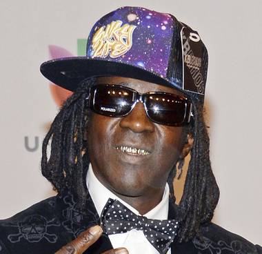 Entertainer Flavor Flav will fight a misdemeanor domestic battery charge stemming from a scuffle with his girlfriend at home in suburban Las Vegas ...