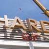 Part of the first sign for the soon-to-open Hard Rock Casino in Atlantic City, N.J., is lifted into place at the building on Friday May 4, 2018. The casino is due to open June 28.