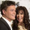Entertainers Donny Osmond and Marie Osmond arrive at Caesars Palace during the resort's 50th anniversary gala Saturday, Aug. 6, 2016, in Las Vegas.