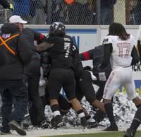 The Mountain West Conference has suspended four UNR football players for their roles in a postgame altercation against UNLV on Nov. 30. The four were suspended for ...
