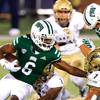 In this Nov. 10, 2020 file photo, Ohio Bobcats wide receiver Isiah Cox (6) runs the ball past Akron Zips linebacker Julian Richardson (7) during an NCAA football game in Athens, Ohio. An NCAA official voiced concern, Thursday, Nov. 12, 2020, over sports betting on the performance of individual student athletes, and suggested that gambling regulators consider restrictions on such wagers to protect the integrity of the games.