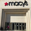 A shopper exits Macy's at the Woodfield Old Orchard Shopping Center in Skokie, Ill., Saturday, Feb. 19, 2022.