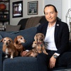James Stern poses with some of his dachshunds at his home in Las Vegas Thursday, Dec. 21, 2023. Stern, a former FBI agent and former global security chief for Wynn Resorts, writes childrens books about the adventures of his dogs. Dogs from left, Jelly, Honey, Peanut and Sandy.