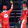Scuderia Ferrari drivers Charles Leclerc, left, and Carlos Sainz wave as they are introduced  during the Formula 1 Heineken Silver Las Vegas Grand Prix opening ceremony Wednesday, Nov. 15, 2023.