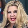Michele Fiore, a Pahrump judge who ran unsuccessfully for state treasurer in 2022, speaks to reporters outside U.S. District Court in Las Vegas on Friday, July 19, 2024, after pleading not guilty to federal fraud and conspiracy charges. Her attorney, Michael Sanft, watches at left.