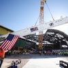 Workers guide the final piece of structural steel in the $600 million renovation of the Las Vegas Convention Center’s (LVCC) legacy campus as it is raised during a topping out ceremony Tuesday, Aug. 13, 2024. WADE VANDERVORT