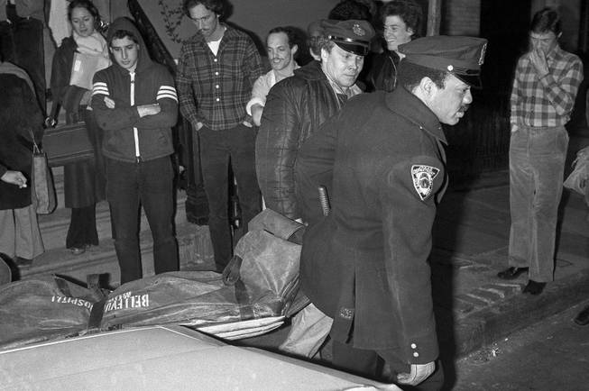 In this Feb. 2, 1979 file photo, New York City police carry the body of punk rock singer Sid Vicious from an apartment in the Greenwich Village area of New York. Authorities said that Sid Vicious, whose real name was John Simon Ritchie, apparently died of an overdose of heroin he took at a party celebrating his release from prison the day before. He had been released on $50,000 bail pending trial in the fatal stabbing of his girlfriend Nancy Spungen. 