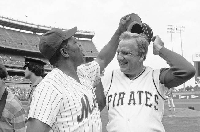 Willie Mays tries to get Ralph Kiners hat as the two Hall of Famers pose for pictures before the start of Old Timers Day game at Shea Stadium in New York on Saturday, August 14, 1982.  Kiner never wore the turn of the century cap that the present day Pirates wear during his playing days.