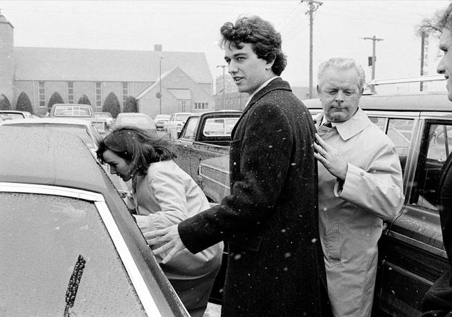  In this March 17, 1984 file photo, Robert Kennedy Jr. and his wife, Emily, get into a car as they are escorted by private investigator Don Wiley outside the courthouse in Rapid City, S.D. Kennedy received a suspended sentence and two years probation on his guilty plea to a charge of heroin possession.