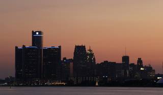 The sun sets on Detroit, Thursday, July 18, 2013. State-appointed emergency manager Kevyn Orr asked a federal judge for permission to place Detroit into Chapter 9 bankruptcy protection Thursday.