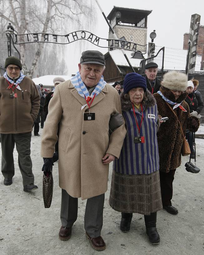 Holocaust survivors arrive for a ceremony to mark the 69th anniversary of the liberation of Auschwitz Nazi death camp's  in Oswiecim, Poland, on Monday, Jan. 27, 2014, since the Soviet Red Army liberated the camp. Israeli lawmakers and government officials are to attend anniversary observances later in the day. 