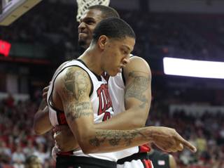 UNLV's Tre'Von Willis and Matt Shaw celebrate after Willis scored and drew a foul during the game against San Diego State at the Thomas & Mack Center on Wednesday. The Rebels won, 76-66.