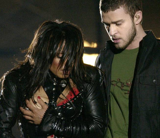 Entertainer Janet Jackson covers her breast after her outfit came undone during her half time performance with Justine Timberlake at the Super Bowl XXXVIII game  in Houston, Sunday Feb. 1, 2004.