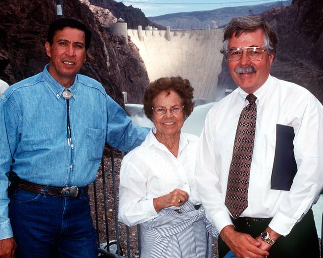 Pictured is Eluid Martinez, Commissioner of the Bureau of Reclamation; Gene Segerblom, Nevada State Assembly Woman; and Bob Johnson, Lower Colorado Regional Director for the Bureau of Reclamation taken on June 11,1998. Tests were being conducted on new needle valves replaced recently in the outlet works at Hoover Dam. View from downriver.