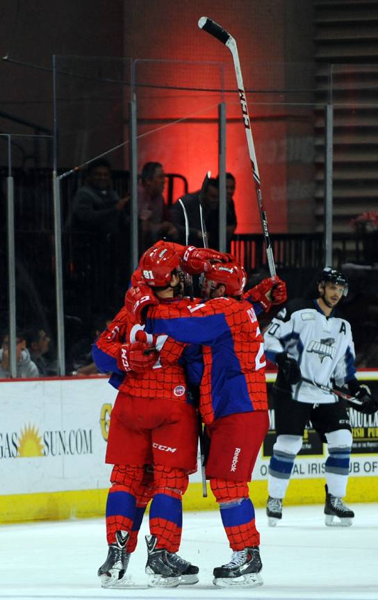 Wranglers players celebrate after center John Armstrong scored an empty-net goal against the Idaho Steelheads in the final seconds of the third period on Saturday night.