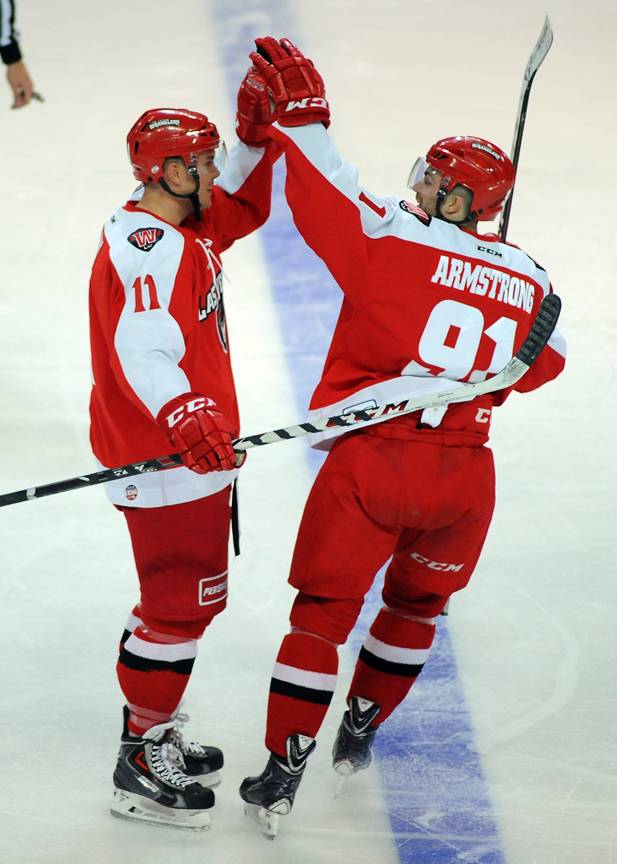 John Armstrong, right, congratulates Wrangler teammate Jeff May after he scored a power play goal against the Alaska Aces on Sunday afternoon at the Orleans Arena.