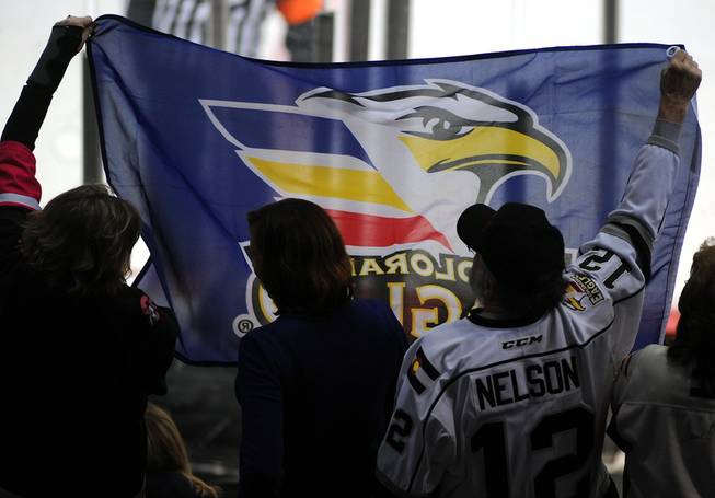 Colorado Eagles fans wave a flag as they celebrate a goal scored against the Las Vegas Wranglers on Tuesday night at the Orleans Arena.
