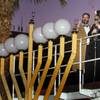 Photo: Attorney Jacob Hafter and Rabbi Shea Harlig light 