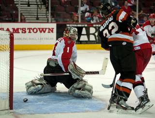 Las Vegas Wranglers goaltender Mitch O'Keefe looks behind him as a Fort Wayne power play shot skitters into the net in the final minute of the second period on Friday night.