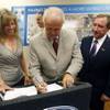 Gov. Jim Gibbons, center, signs a contract for the I-15 Design-Build project Thursday at Las Vegas Paving offices. With Gibbons are Susan Martinovich, director of Nevada Department of Transportation, and Rossi Ralenkotter, president and CEO of the Las Vegas Convention and Visitors Authority. The $246.5 million project is funded through Assembly Bill 595, which includes funds diverted from room tax revenue.