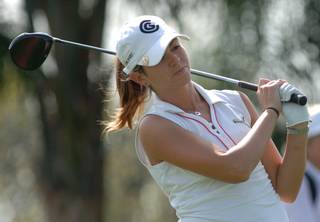 In this photo taken on April 12, 2007,  golfer Erica Blasberg watches her tee shot on the 18th hole during the first round of the LPGA Ginn Open golf tournament in Reunion, Fla. 