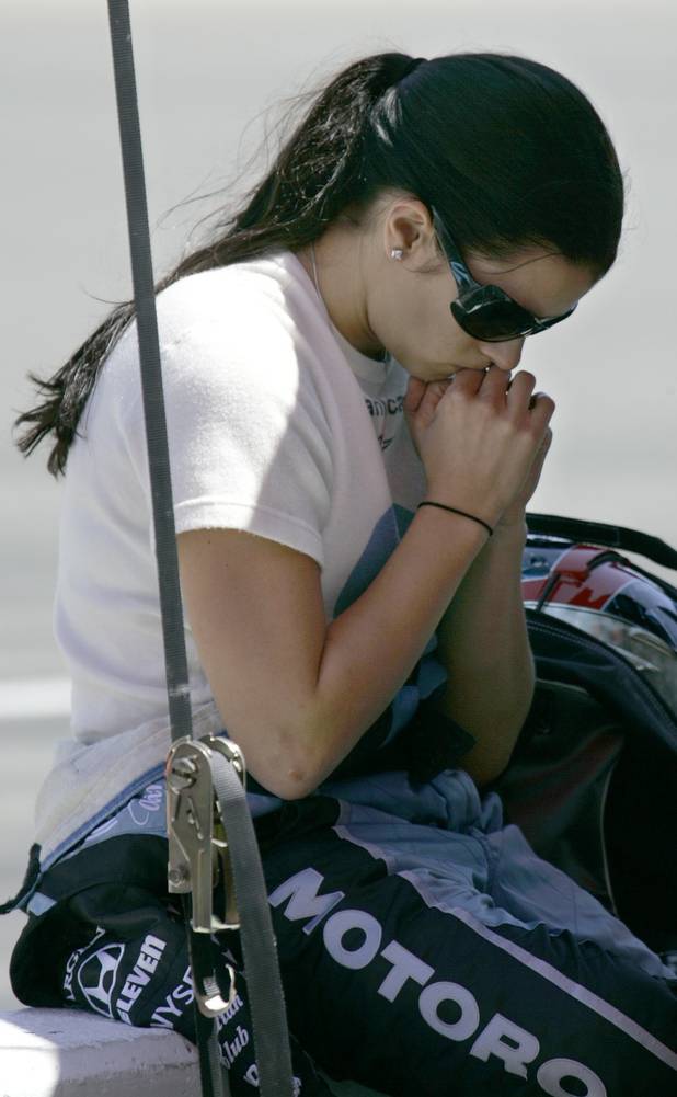 Danica Patrick takes a quiet moment prior to taking practice ...