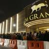 Visitors queue up for entry of the new MGM Grand Macau casino resort after the opening ceremony in Macau, Tuesday, Dec. 18, 2007. 