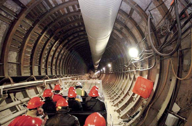 Workers enter the main tunnel of Yucca Mountain.
