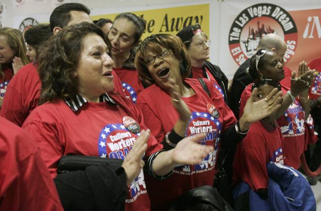 Union members Maria Cortes, left, and Faye Williams cheer as ...
