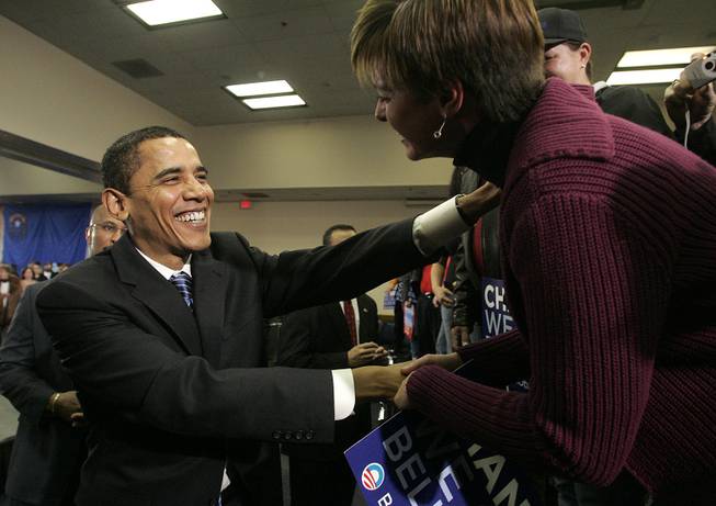 Sen. Barack Obama greets supporter Renee Wood after holding a town hall meeting in Henderson. Obama and his two major rivals are crisscrossing Nevada as the state counts down to its caucuses.